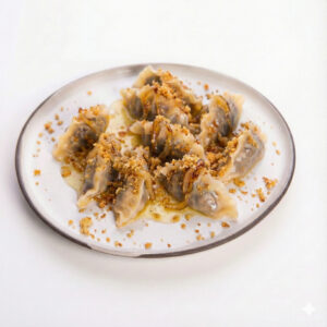 pierogi monka z kapustą i grzybami z okrasą 1 szt.